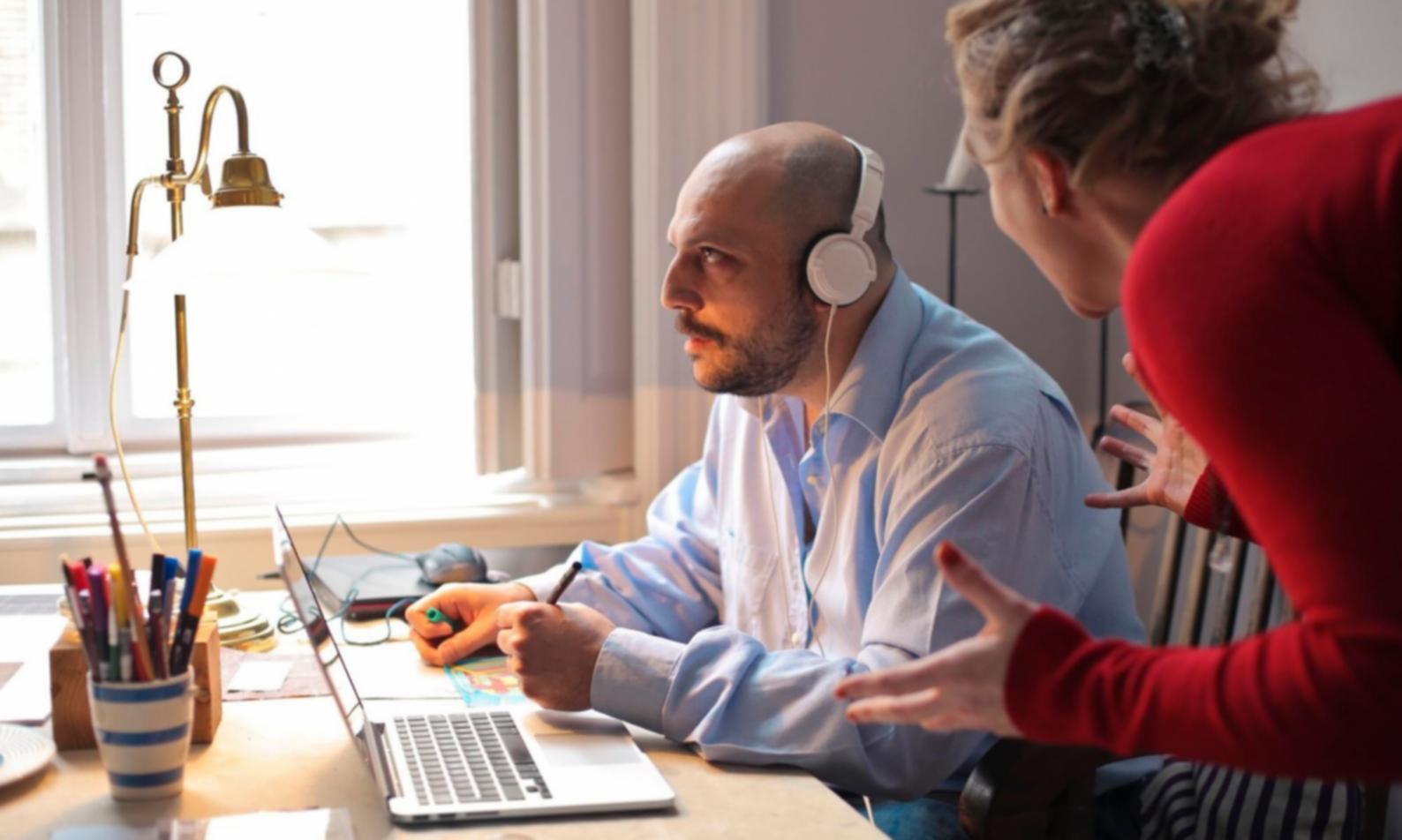 Financial professionals analyzing blockchain energy data on multiple monitors